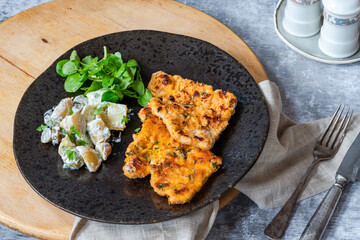 Lemon and thyme pork schnitzel with potato salad