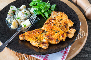 Lemon and thyme pork schnitzel with potato salad