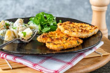 Lemon and thyme pork schnitzel with potato salad