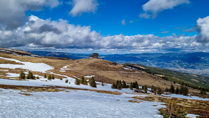 Panoramic view of mountain hut Wolfsbergerhuette (Wolfsberger Huette) on Saualpe, Lavanttal Alps, Carinthia, Austria, Europe. Alpine road leading to remote cottage. Panorama on Wolfsberg and Koralpe
