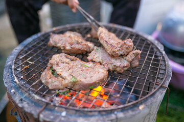 Grilled pork, Meat on a charcoal grill.	