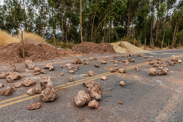 Stones blocking 28G road during protests on December 15, 2022 near Huayllarcocha village near...