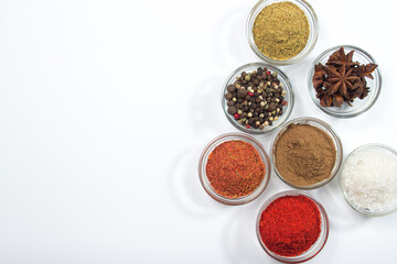 Various spices on a white background. There is room for copy space