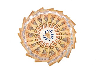 Banknotes of fifty euros arranged in circle shape on white background. Copy space.