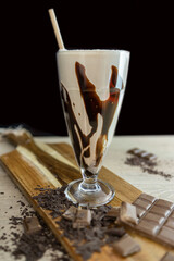 Chocolate milk shake with straw
