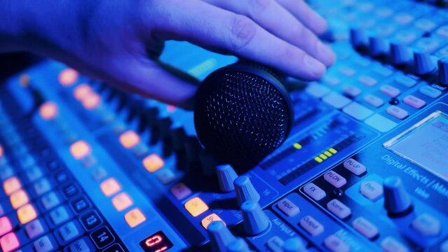 Electronic music mixing console is operated by a music editor
