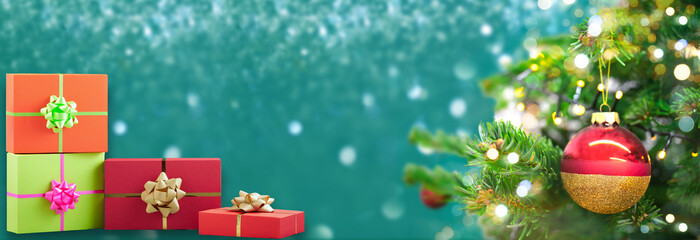 Decorated Christmas tree on blurred background. Happy New Year and XMas border with free copy space for text. christmas gift and presents banner