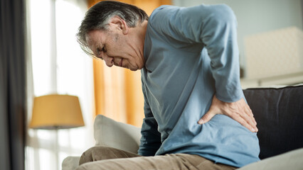 Old man suffering from back pain - 554260796