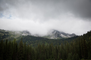 Three Bears mountain peaks under cloud in Fernie, Canada.