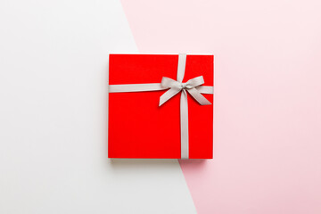 holiday handmade present tied gray ribbon bow top view with copy space. Flat lay holiday background. Birthday or christmas present. Christmas gift box concept with copy space
