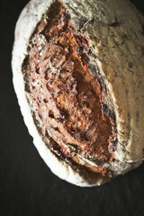 Whole wheat bread on black background