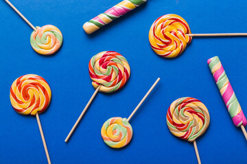 Set of colorful lollipops on colored background. Summer concept. Party Happy Birthday or Minimalist...