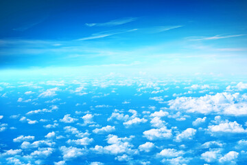 Fluffy clouds top view of the airplane. Heavenly landscape.
