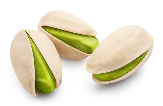 Three delicious pistachios, isolated on white background