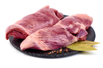 Raw pork heart, offals, isolated on white background. High resolution image.