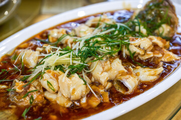 A delicious Chinese dish, steamed sea bass fillets