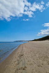 Picturesque sandy coast of the Baltic Sea. Vacation on the beach.
