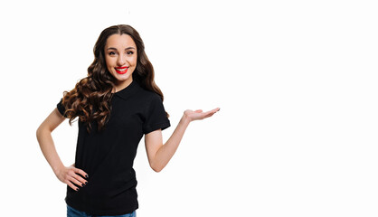 Beautiful girl presenting. Smiling woman showing open hand palm with copy space for product or text. Female posing over white background.