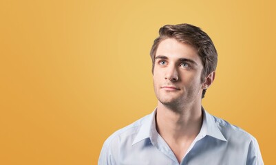 Handsome young man posing on background