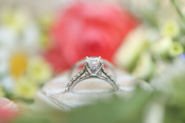 Bride diamond wedding ring and engagement band in a cream velvet ring box