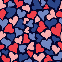 Seamless pattern with romantic blue and red hearts on a dark blue background. Valentines day, wedding, mothers day pattern.