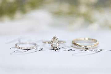 Bride diamond wedding ring and engagement band in invitation