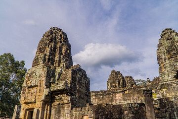 Fototapeta premium A view of Khmer temple towers at Bayon Temple in Angkor Wat, Cambodia