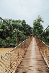 Vertical view of a rudimentary bridge over a river in rural Cambodia near Battambang