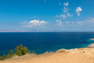 Obraz premium Panoramic view of the turquoise Aegean Sea with rocky coastline. In the northwestern part of the Greek island of Rhodes. Greece Europe.