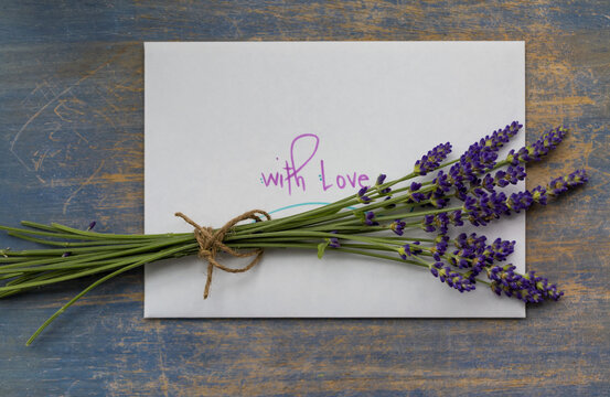 Lavender posy and a message with love on a wooden background; Studio Shot