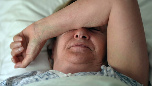 Tired Older Person Waking Up Senior Woman Getting Up From Bed In Morning Routine