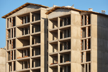 Building facades under construction. Work in progress. Engineering and investment