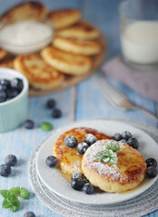 Cottage cheese pancakes - traditional Russian syrniki	