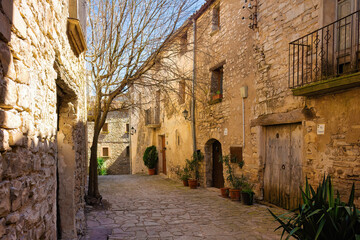 Street in the walled historic center of Montfalcó Murallat, Catalonia, Spain