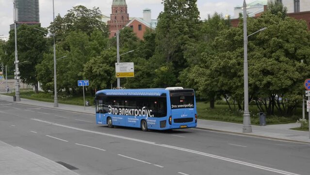 Electrobus goes down the prospekt street in Moscow, side view.
