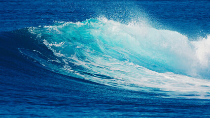 Ocean wave breaks in the ocean in the Maldives