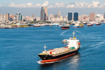 The container ship is leaving the Port of Kaohsiung, Taiwan.