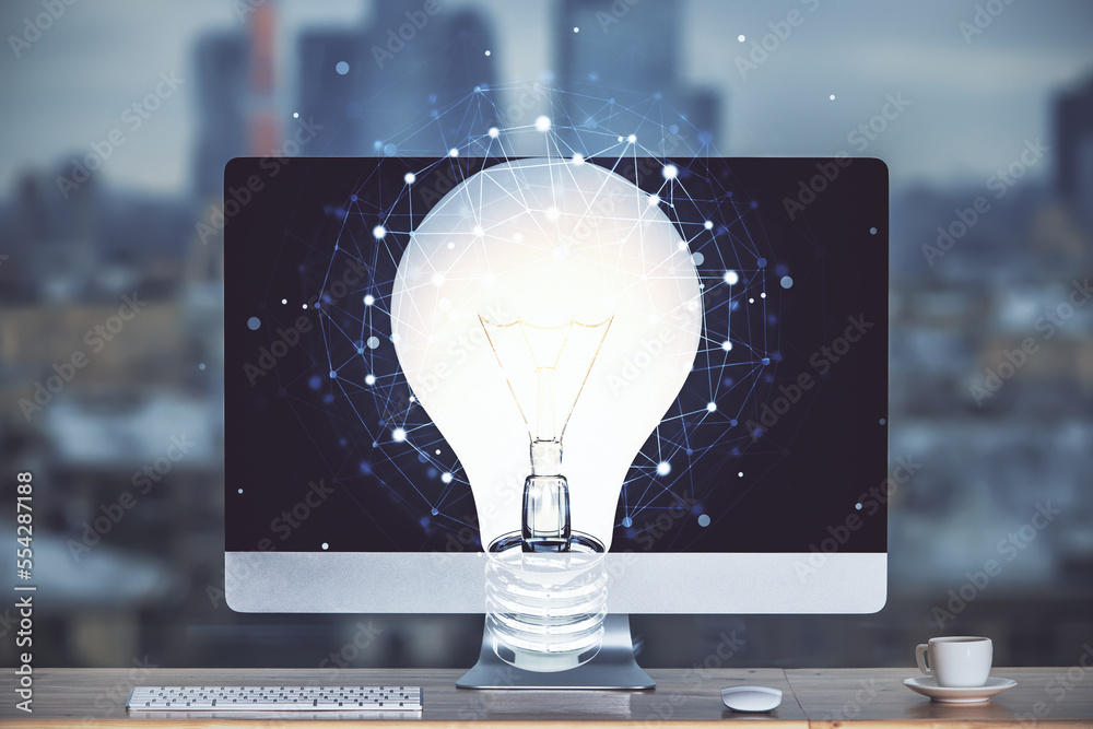 Poster Computer on desktop in office with bulb icon hologram. Multi exposure. Concept of idea.