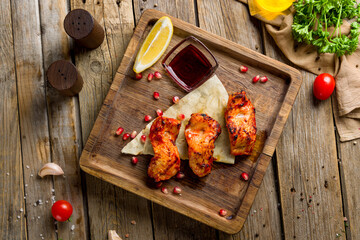 shish kebab from sturgeon on wooden board top view