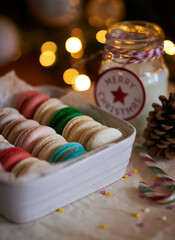Christmas macarons with hot milk mug and candy