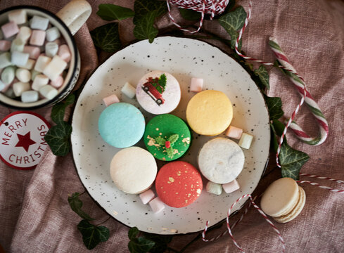 Christmas Macarons On Plate From  Above With Hot Chocolate Mug And Munchmallows