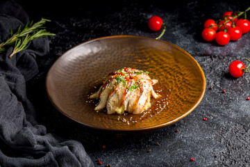 eel on rice on dark stone table (Unadzyu)