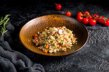 Fried rice with seafood on dark stone table