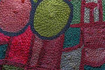 Abstract background closeup of embroidery with art stitches. Rough Coarse thread, thick seams....