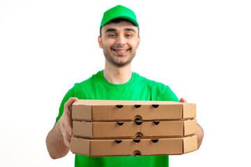 Pizza Delivery Driver with pizza box. Courier in uniform cap and t-shirt service fast delivering orders. Young man holding a cardboard package. Character on isolated white background