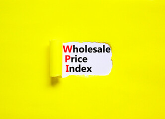 WPI wholesale price index symbol. Concept words WPI wholesale price index on white paper on a beautiful yellow background. Business WPI wholesale price index concept. Copy space.