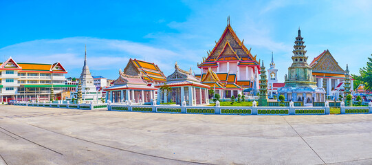 Panorama of Wat Kanlayanamit temple with Khmer styled shrines on foreground, Bangkok, Thailand