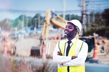 African civil engineering works and stands to supervise building new roads and inspecting the construction site with backhoe and mechanics.