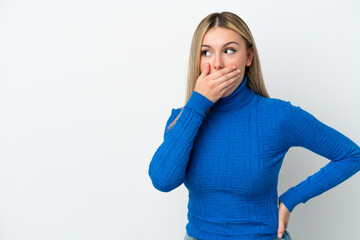 Young caucasian woman isolated on white background doing surprise gesture while looking to the side
