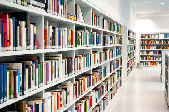Inside a modern library with white book shelves and white wall in Stuttgart on FEB 11 2015